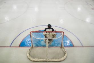 Goalie in his net