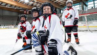 Novice players kneeling and smiling